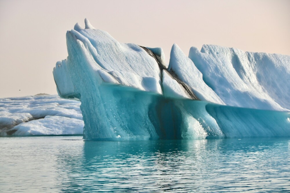 a large iceberg in the middle of a body of water